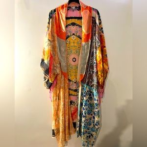 Free people multi colored kimono with beading in sleeves.